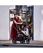 1978084110_F12_2026_maxicosi_stroller_oxfordplus_espressobrown_oxford_lifestyle_mompushingstrollerthroughcity